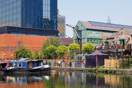 Birmingham, UK: June 29, 2018: Regency Wharf at Gas Street Basin. The restored canal system in Birmingham central is a national heritage landmark and where the Worcester and Birmingham canals meet.のeditorial素材