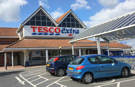 Llanelli, UK: June 14, 2018: Main entrance to a Tesco Extra superstore. Disabled parking spaces give easy access to the store. Tesco is the UK's largest supermarket chain.のeditorial素材