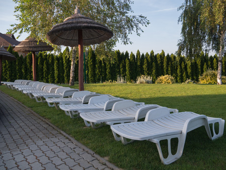 plastic deck chair in the gardenの写真素材