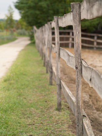sandy road with wooden fenceの写真素材