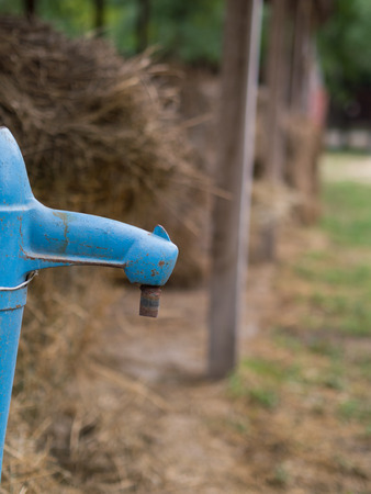 blue artesian water fountain on the farmの写真素材