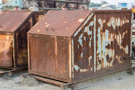rusty waste containers in the industryの写真素材