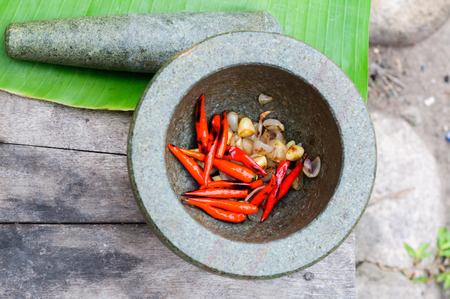 grill chilli garlic onion and pound in mortar stoneの写真素材