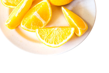 Fresh slices orange fruit isolated on dishの写真素材