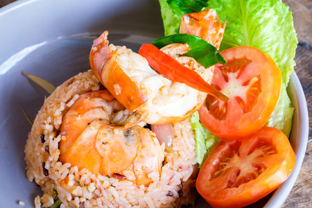 Close-up fried rice with shrimp on wood tableの写真素材