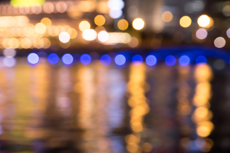 City night lights blurred bokeh reflect of river backgroundの写真素材