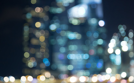 Singapore building city night lights bokeh of marina bay blurred  backgroundの写真素材