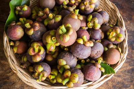 fresh mangosteen fruit in basketの写真素材