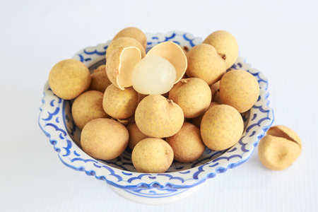 longan fresh in ceramic tray on the backgroundの写真素材