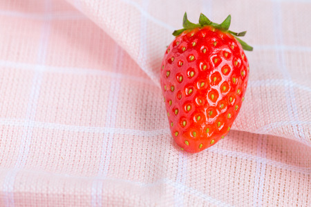 fresh ripe red strawberries on pink fabricの写真素材