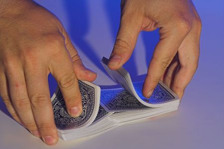 hands shuffling deck of cardsのeditorial素材