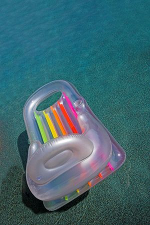 pool raft floating in empty poolの写真素材