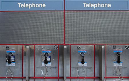 row of payphones at airportの写真素材