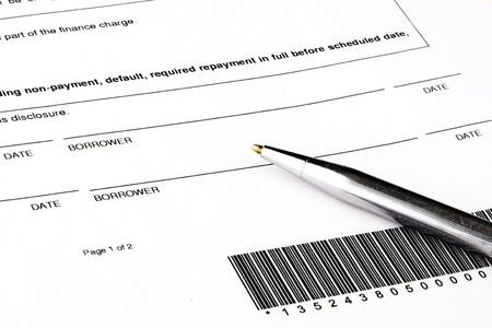 pen indicating where a borrower should sign a loan documentの写真素材