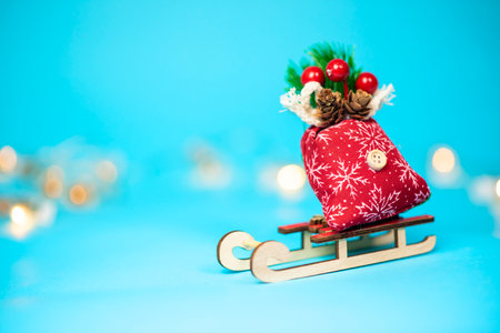Christmas and New Year concept. a wooden sleigh with gifts on a blue background.の写真素材