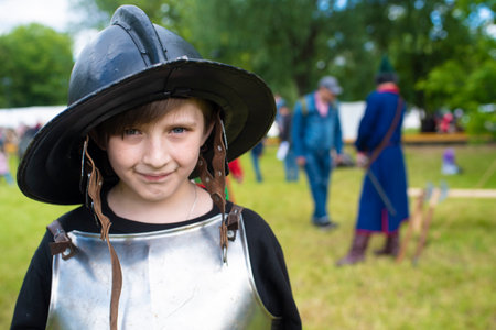 happy 10 year old child in European historical costume.の写真素材