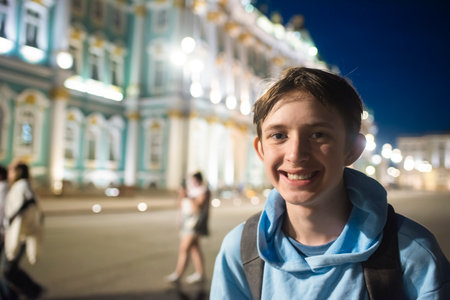 Portrait of a 12 year old boy on the Palace Square in St. Petersburg, in front of the Winter Palace,...