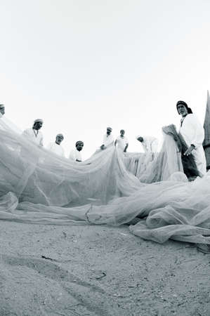 Unidentified people walking on the beach.の写真素材