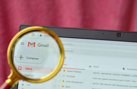 California, USA, 2020. Gmail application open on a browser and logo seen through a magnifying lens. Out of focus laptop screen is in the background. Concept Business continuity - Work from homeのeditorial素材