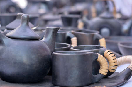 The Stone Pottery of Longpi, traditional craft practiced by the Thankul Naga tribes from Manipur, India at display in shop in Dilli Haat, Delhi. It is used both for cooking and storing foodstuff.の写真素材
