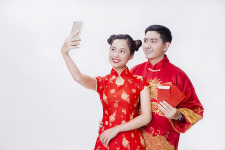 Chinese couple selfie together for new yearの写真素材