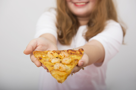 A lovely girl feeling happy and happy with a fastfoodの写真素材