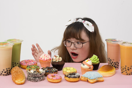 A lovely girl with a cupcakeの写真素材