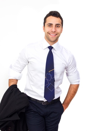 Closeup of a young smiling business man standing with hand in pocketの写真素材
