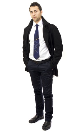 Portrait of a serious young businessman with hands in pocketsの写真素材