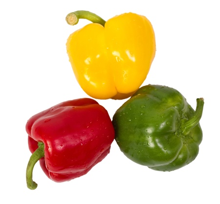 Three wet green red and yellow paprika(capsicum) isolated on white backgroundの写真素材