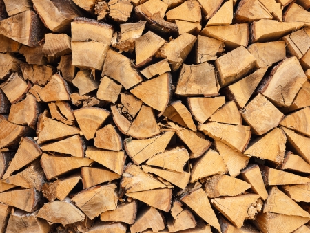 Closeup of well stacked firewood.Can be used as natural background textureの写真素材