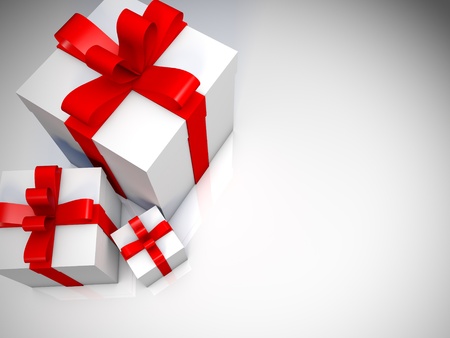 Closeup of three white gift boxes with red ribbon on white floor.White backgroundの写真素材