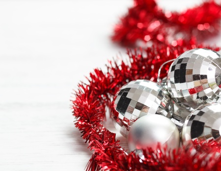 Christmas arrangement with silver baubles and red garland Copy space on left の写真素材