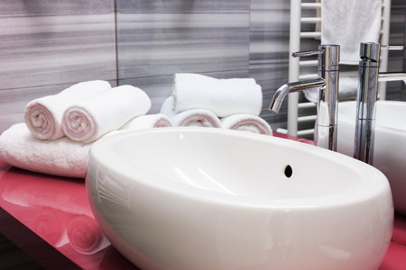 Modern white oval sink in bathroom. の写真素材