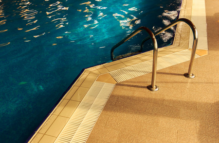 Relaxing swimming pool with clean water at spaの写真素材