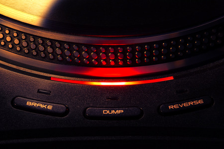 Macro photo of spinning turntable with check light turned on. Vintage effect.の写真素材