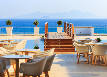 KARDAMENA, KOS/GREECE - July 29, 2015: Long pool with salt water. The biggest attraction of the Mitsis Blue Domes resort, especially in afternoons and evenings when this place is highly populated.のeditorial素材