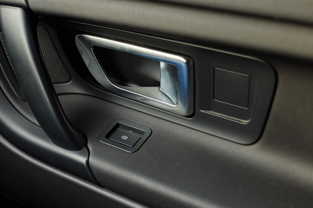 Metallic car door handle with window control buttonの写真素材
