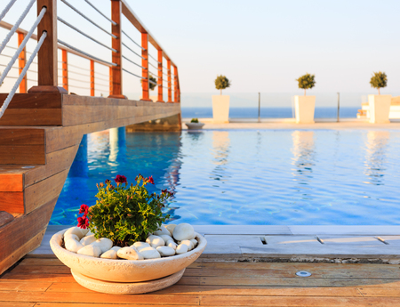 KARDAMENA, KOS/GREECE - July 29, 2015: Long pool with salt water. The biggest attraction of the Mitsis Blue Domes resort, especially in afternoons and evenings when this place is highly populated.のeditorial素材
