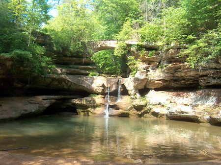 Small waterfall with reflecting pool below walkway archの写真素材