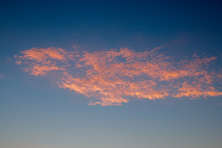 Pink Clouds on dark blue sky during sunrise