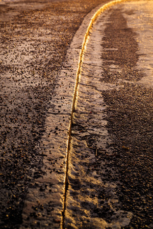 Close-up of curb in golden morning lightの写真素材
