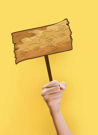 Illustrated wooden sign board in hand on light yellow background. Illustration of creative stylish wooden signboard in hand.の写真素材