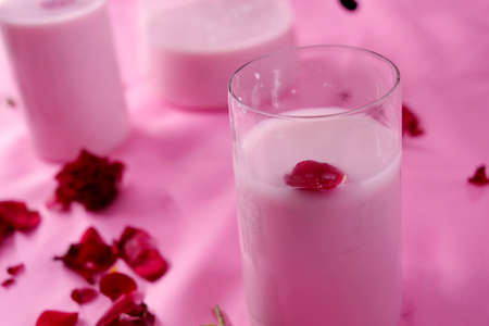 Milkshake in transparent glass on dark background.の写真素材