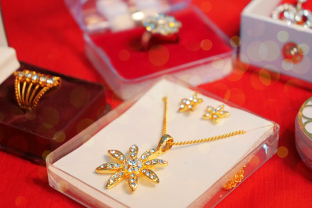 Indian wedding Jewellery on red cloth backgroundの写真素材