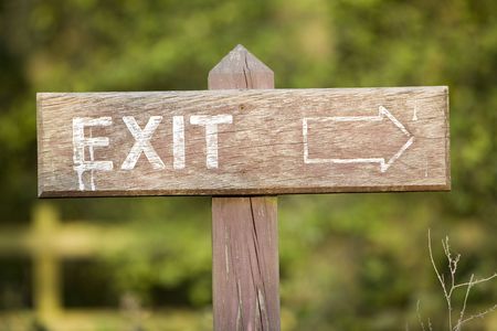 seen better days sign post saying exit and arrow pointing the wayの写真素材