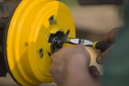 person working on the back brakes of a carの写真素材