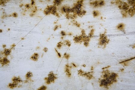 close up image of white paint on a lorry with rust showingの写真素材