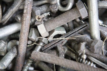 close up image of old nuts and bolts