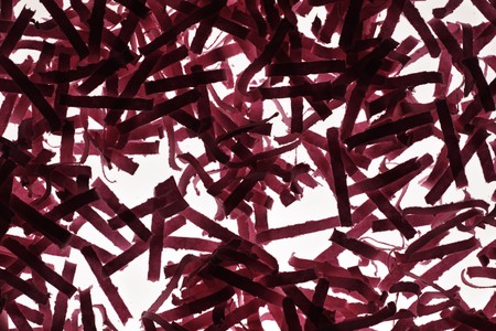 close up detail image of sheredded red paperの写真素材